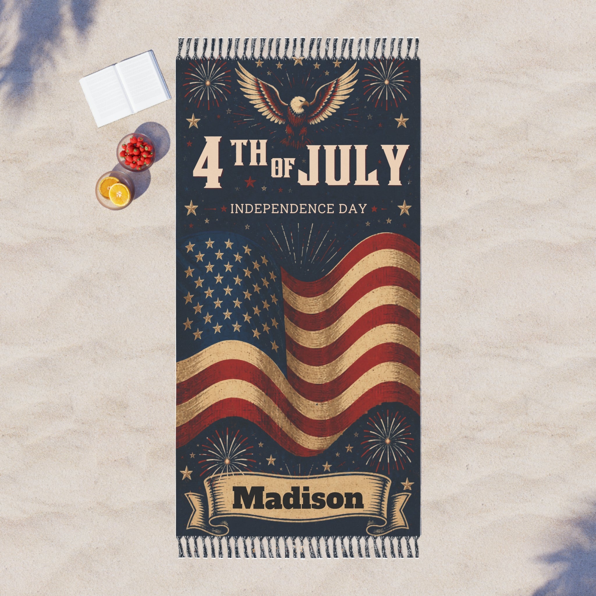 Patriotic 4th of July beach towel spread out on the sand