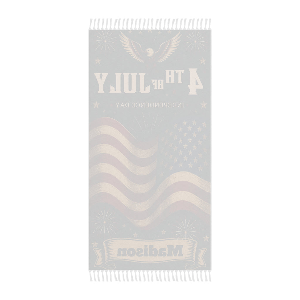 Boho tasseled 4th of July beach towel draped on a lounger