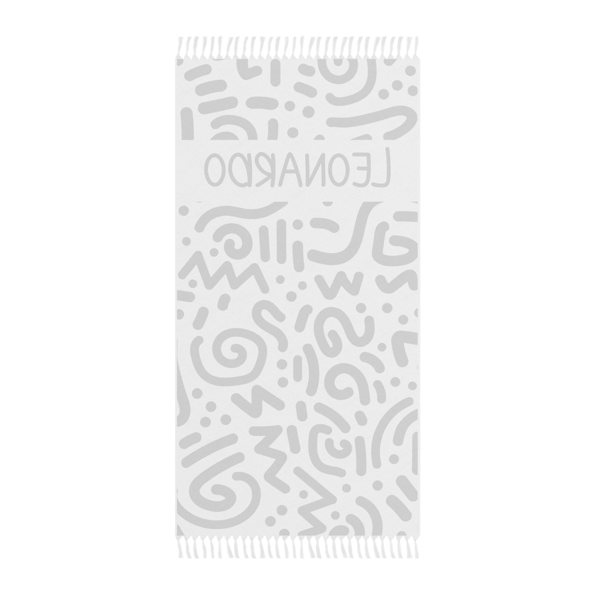 Personalized abstract doodle beach towel laid flat with boho tassels