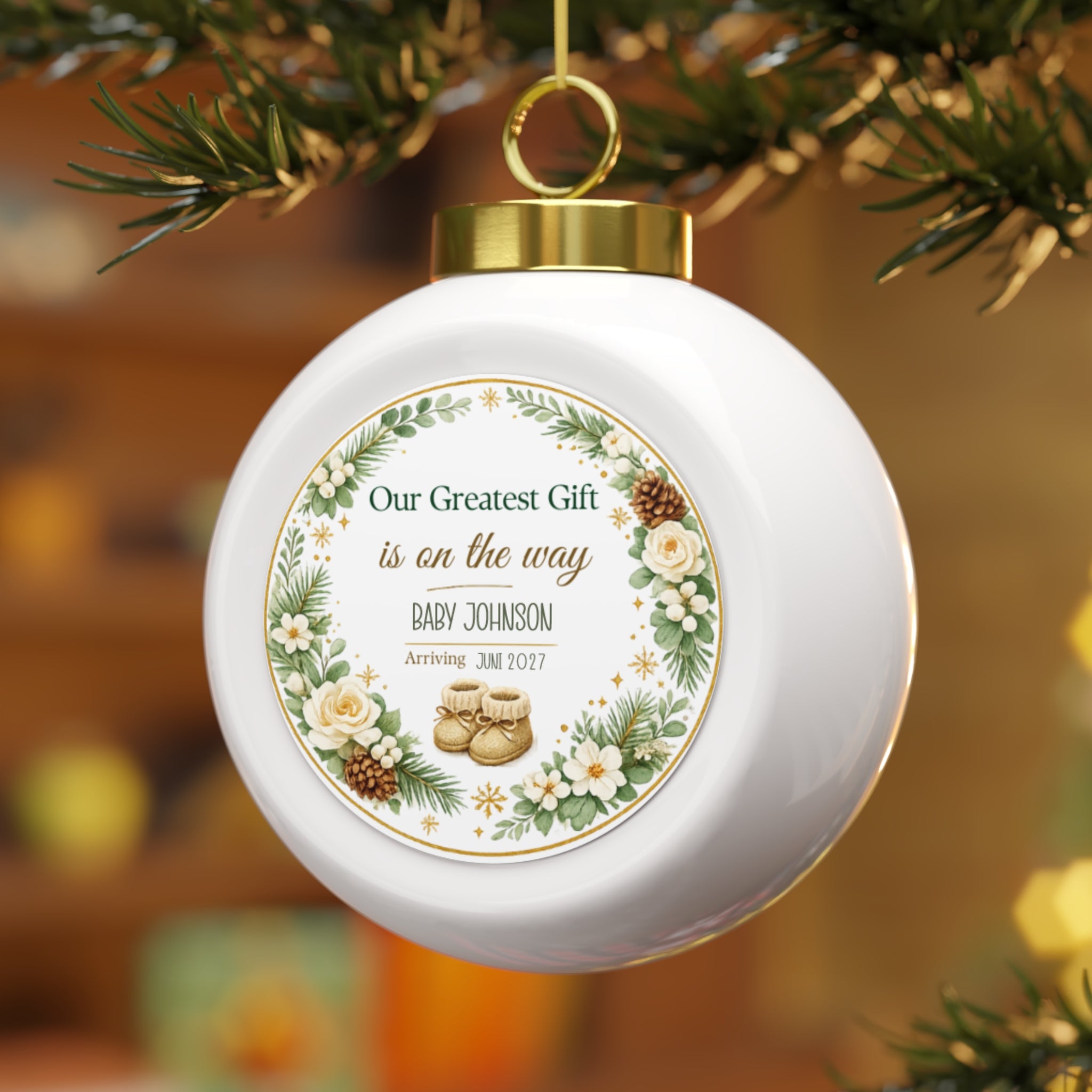 Baby announcement Christmas ornament hanging on a Christmas tree