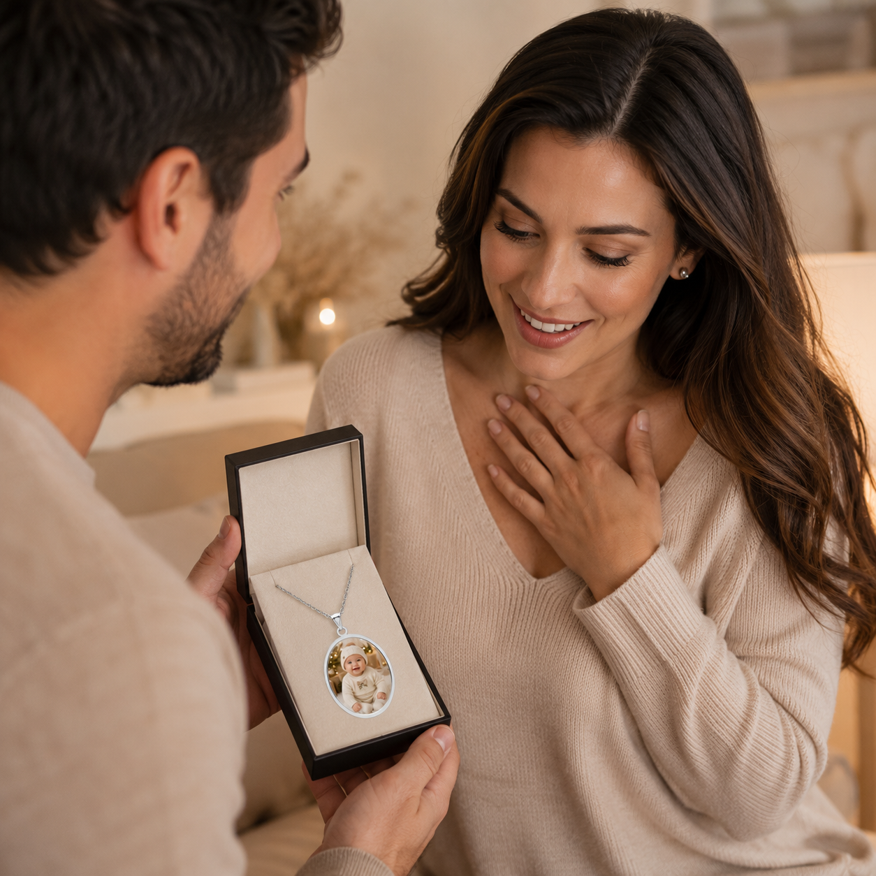 Personalization guide showing how a baby photo is placed in the oval silver pendant