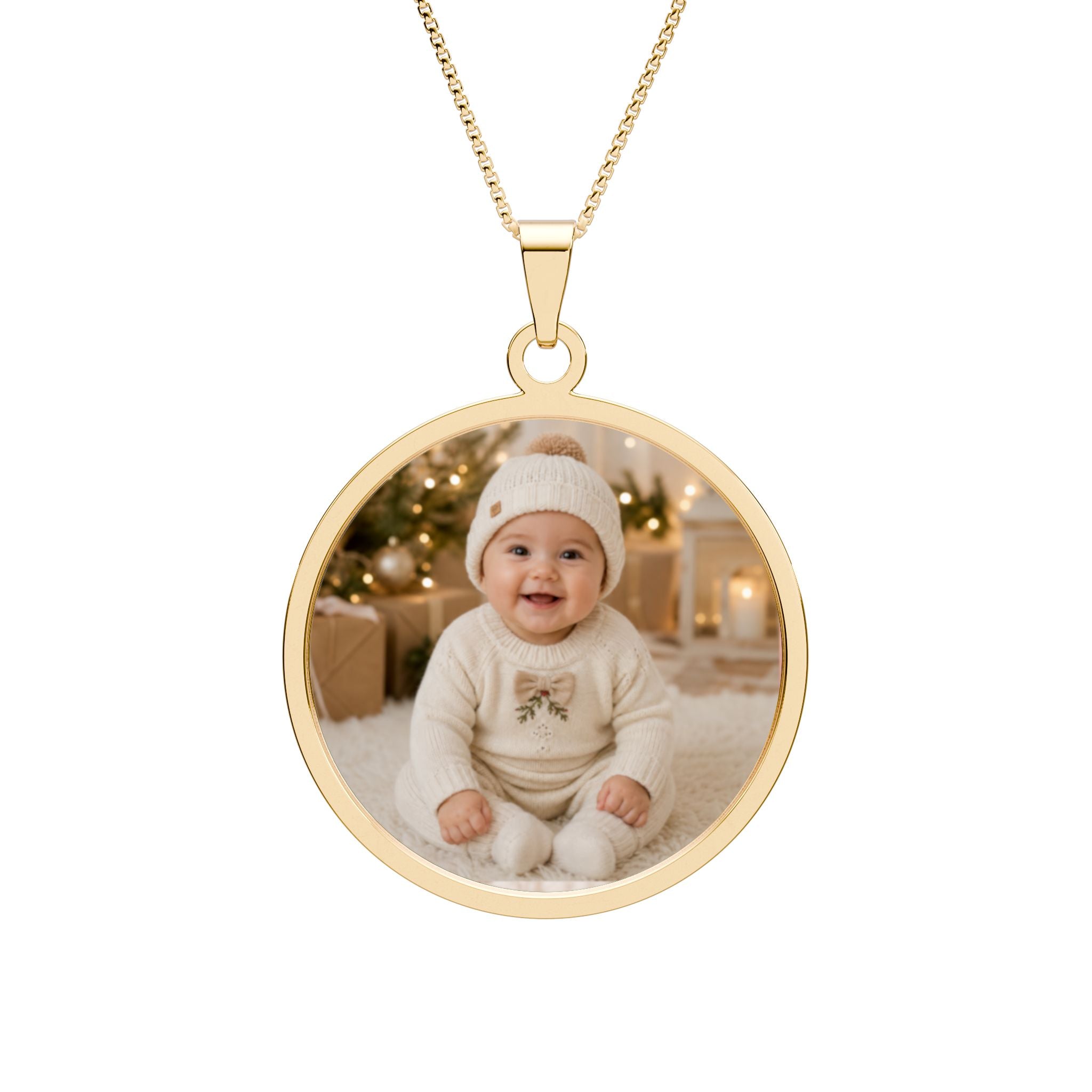Personalized baby photo necklace in a gold-plated round pendant with an engraved border on a box chain