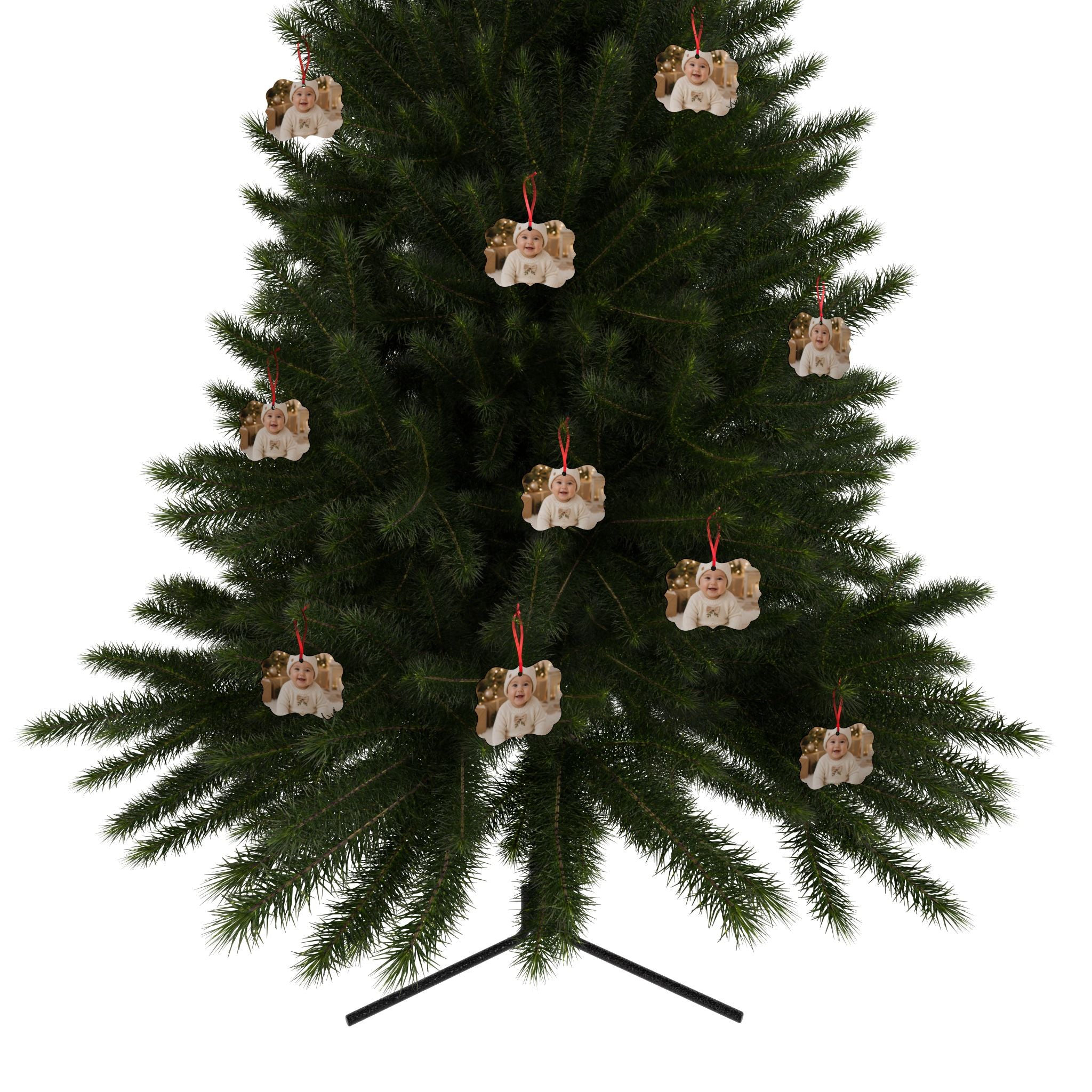 Personalized baby photo ornament hanging on a Christmas tree