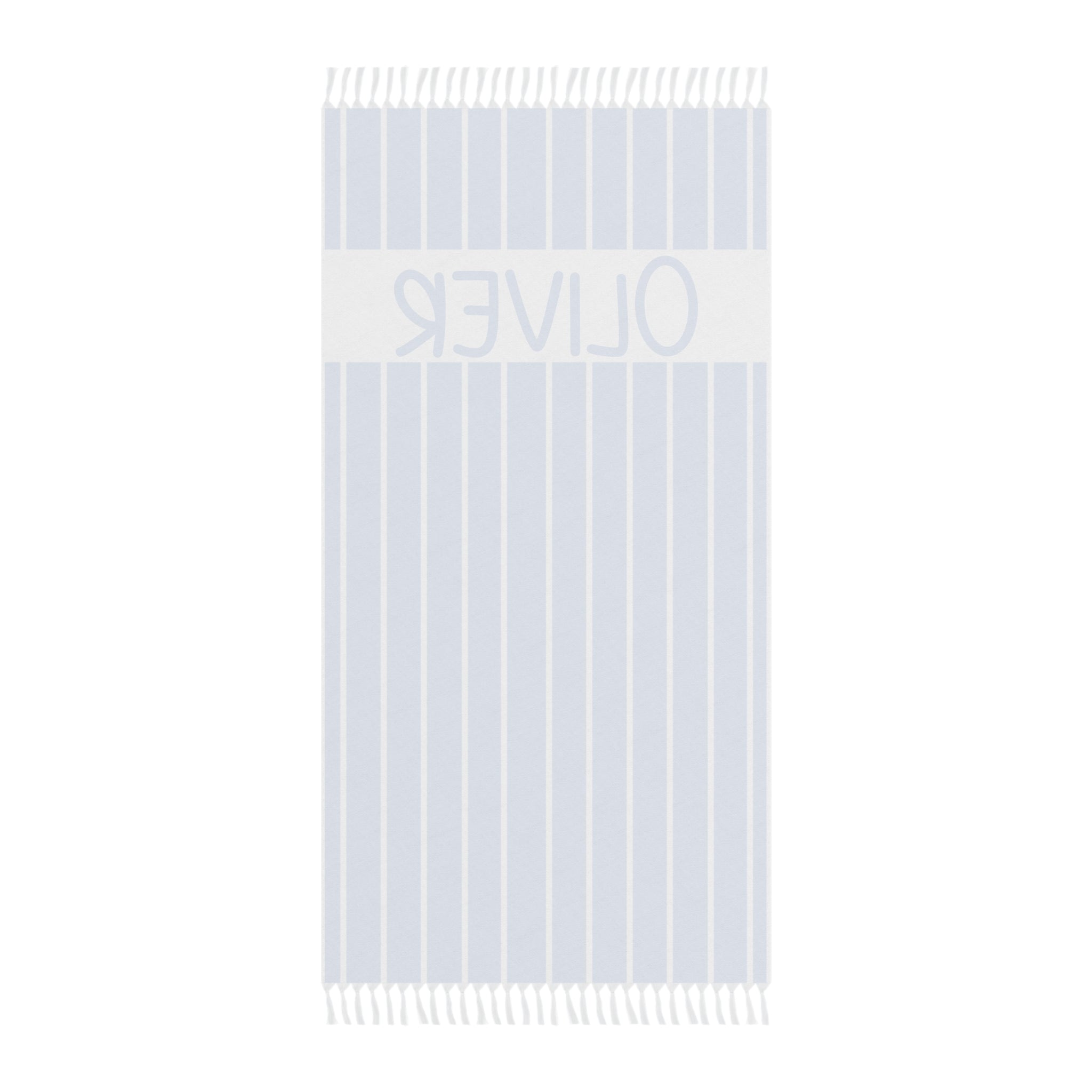Personalized blue stripe beach towel laid flat with boho tassels