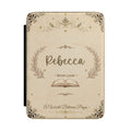 Personalized book lover Kindle case with a vintage aged-paper design, ornate border, open book, and a custom name