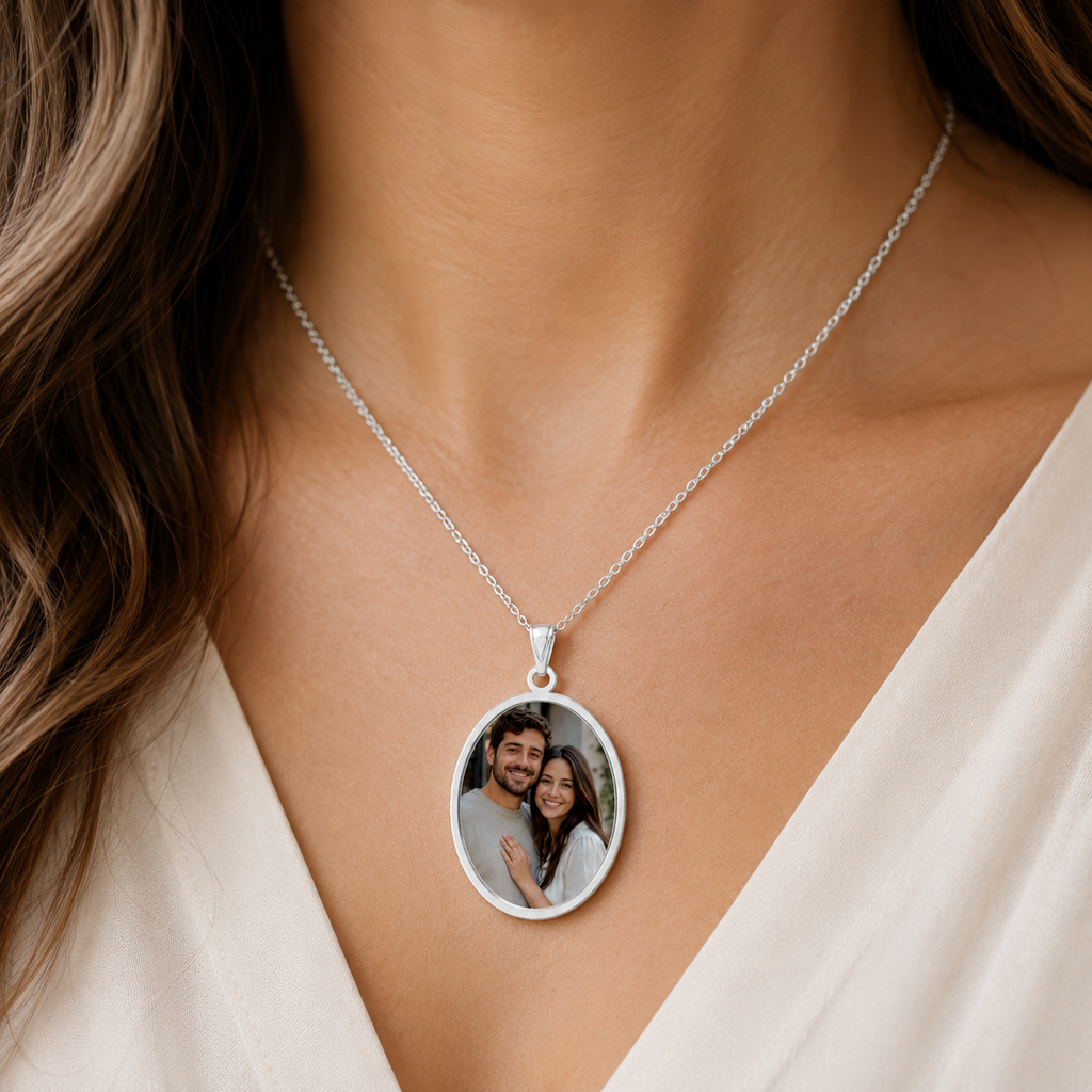 Close-up of the engraved oval frame on the sterling silver couple photo pendant