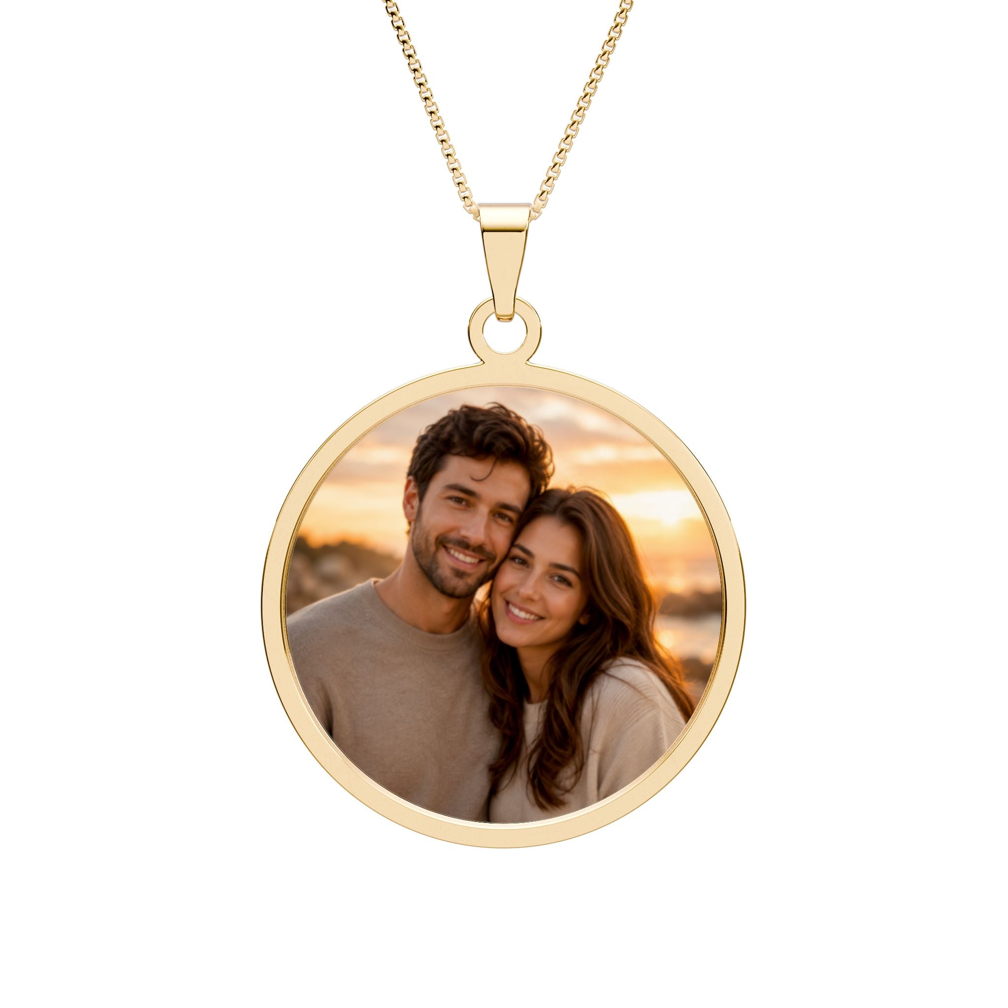 Personalized couple photo necklace in a gold-plated round pendant with an engraved border on a box chain