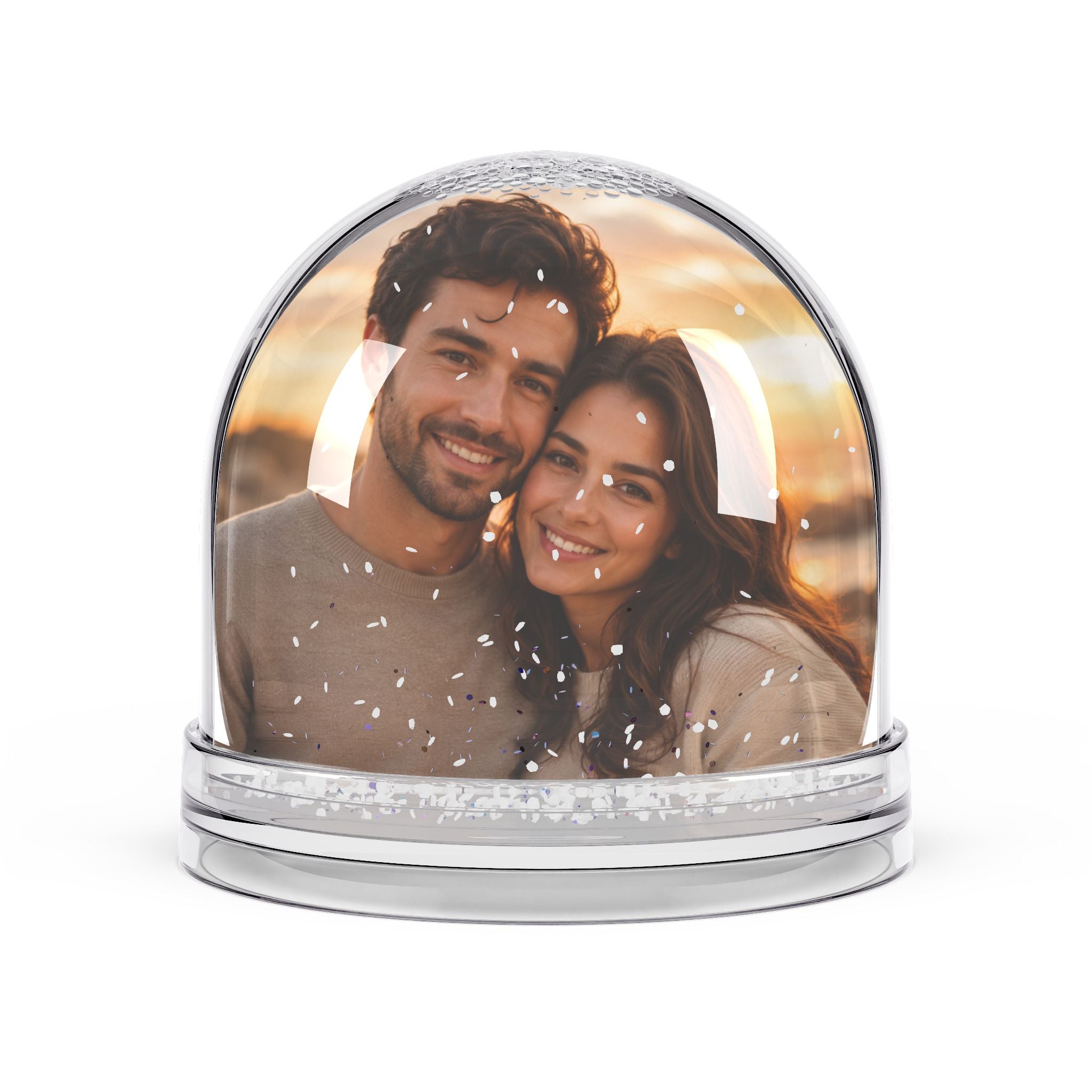 Close-up of the couple photo snow globe showing glitter snow inside the clear dome