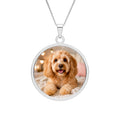 Personalized dog photo necklace in a sterling silver round pendant with an engraved border on a box chain