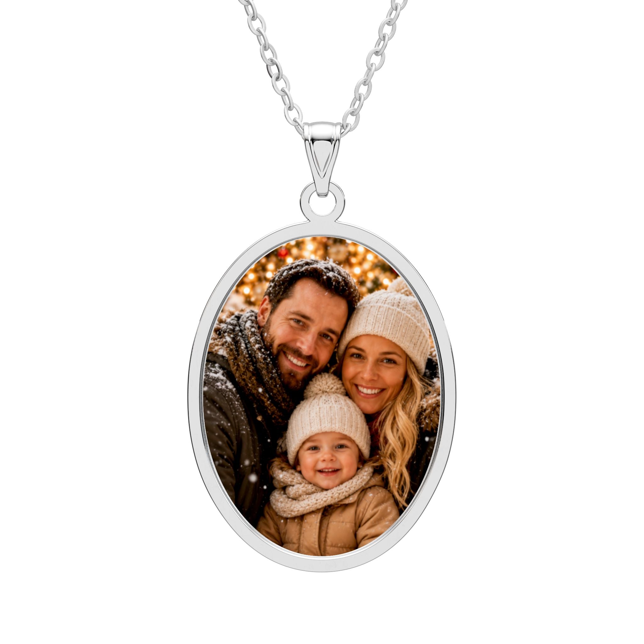 Personalized family photo necklace in an oval sterling silver pendant with an engraved frame on a cable chain