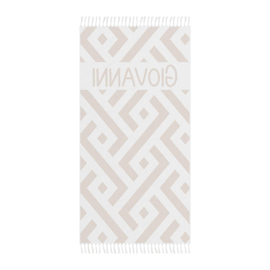 Personalized geometric beach towel laid flat with boho tassels