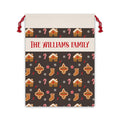 Personalized gingerbread Santa sack with a family name band, gingerbread houses and candy canes on a brown drawstring bag