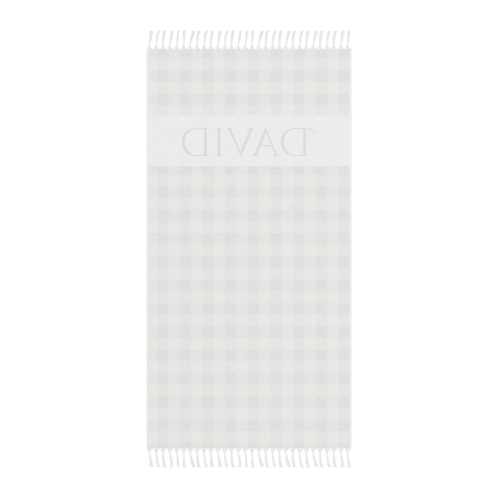 Personalized gingham beach towel laid flat with boho tassels
