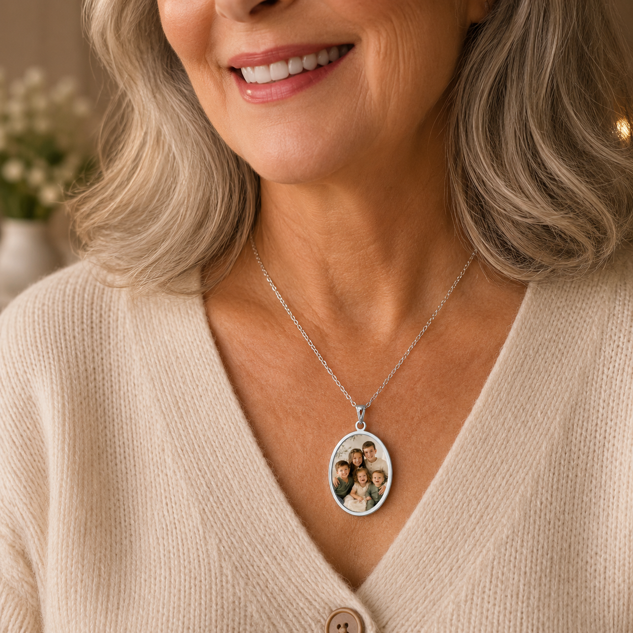 Close-up of the engraved oval frame on the sterling silver photo pendant