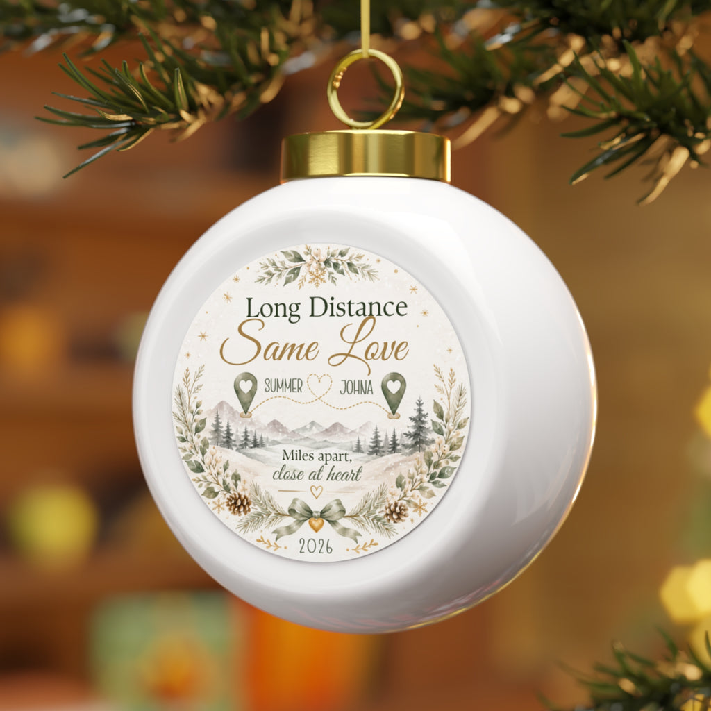 Long distance couple Christmas ornament hanging on a Christmas tree