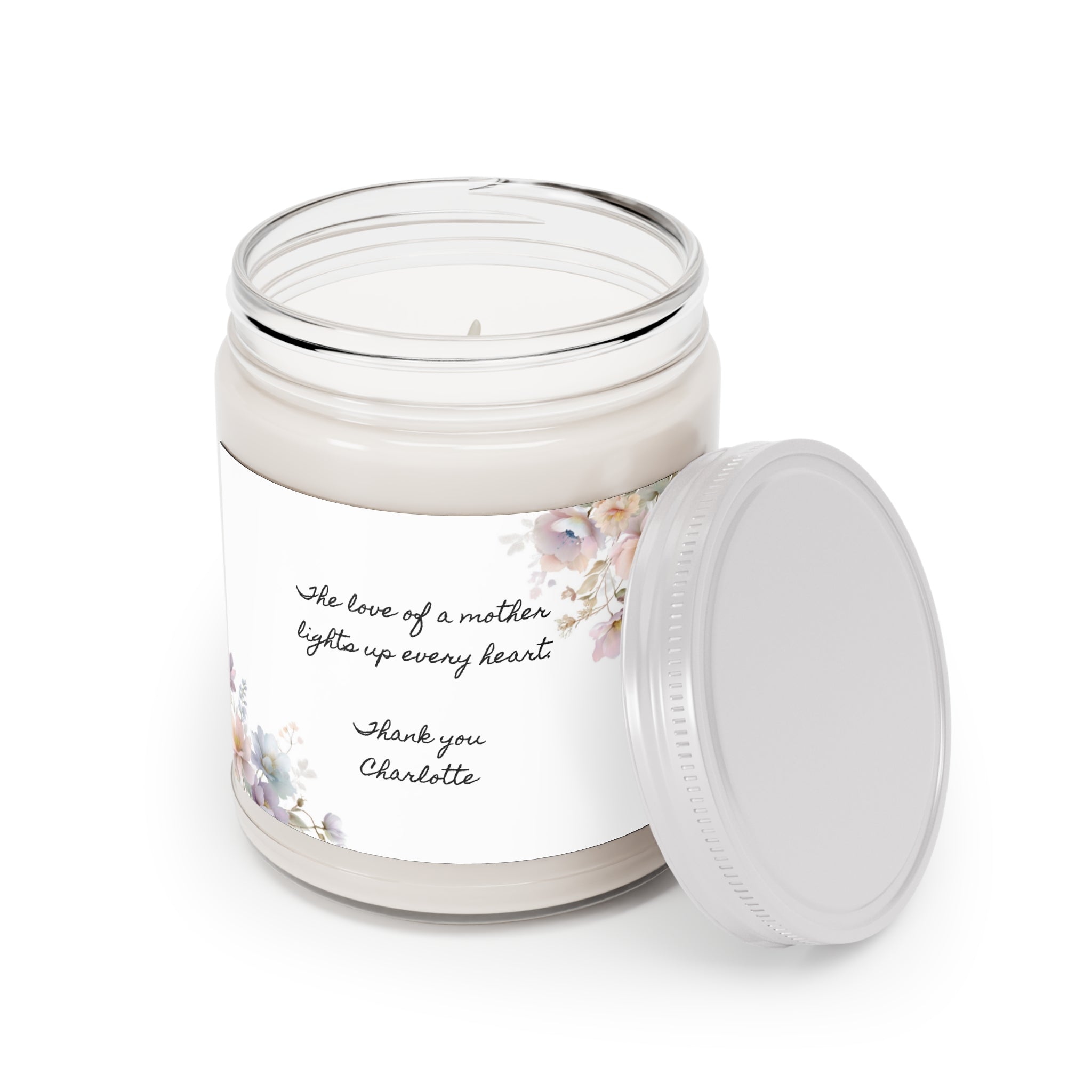Personalized Mother's Day candle styled at home beside fresh flowers