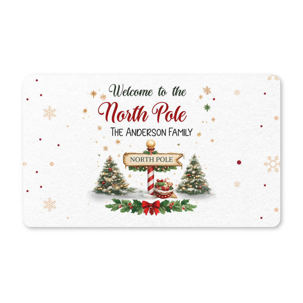Personalized North Pole Christmas doormat with a family name, a North Pole sign and decorated trees on a snowy background