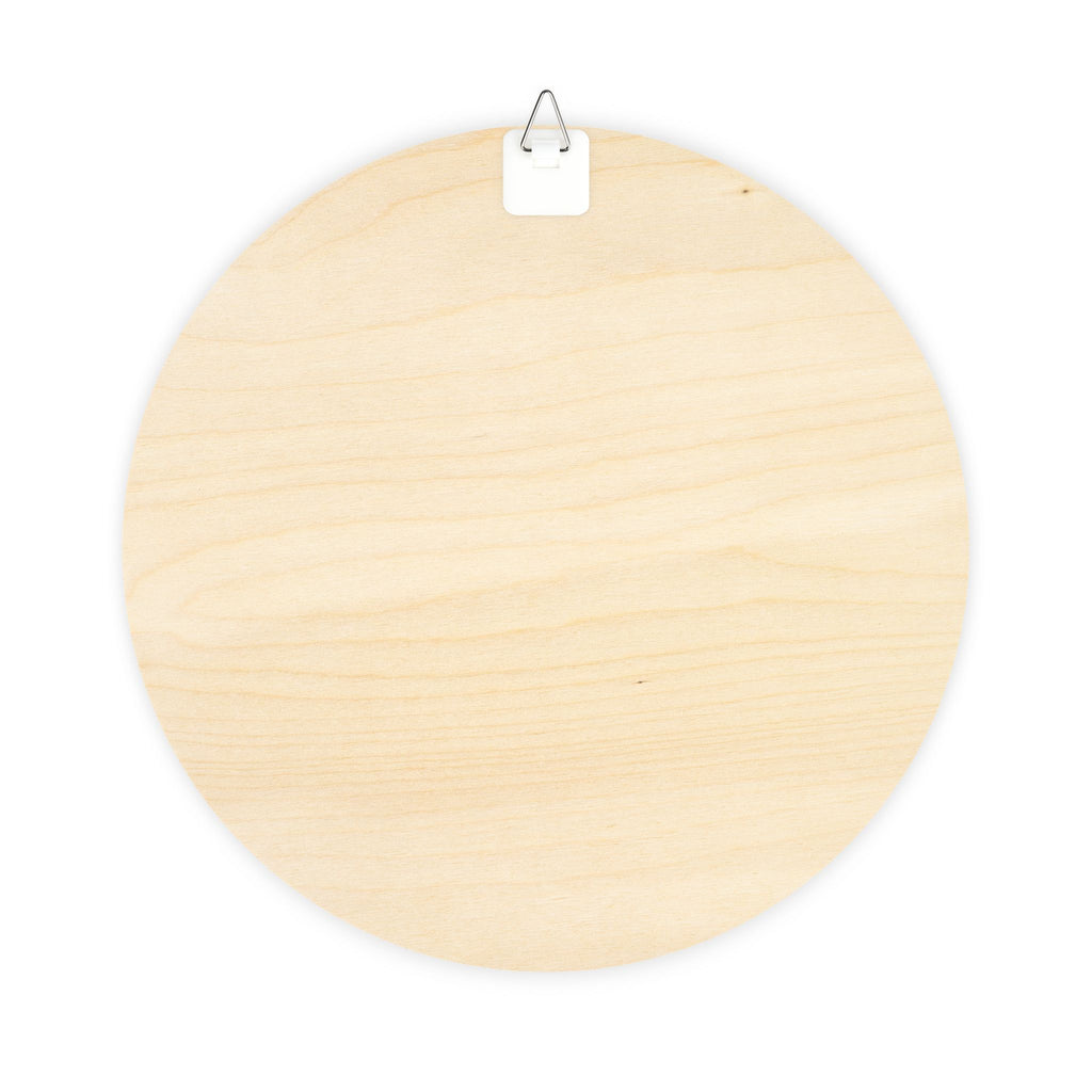 North Pole wood plaque shown hanging by a door with jute twine and metal hook