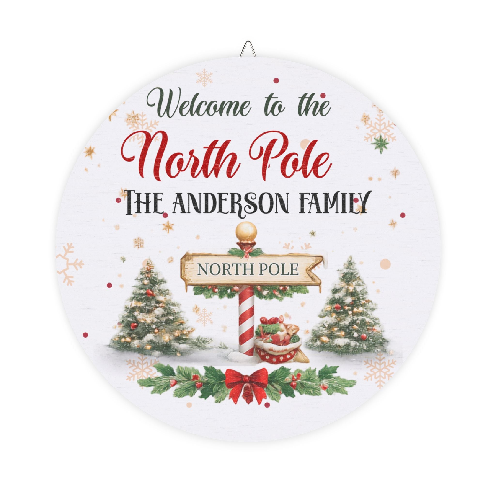 Personalized North Pole wood plaque with a family name, a North Pole signpost and decorated trees on round birch