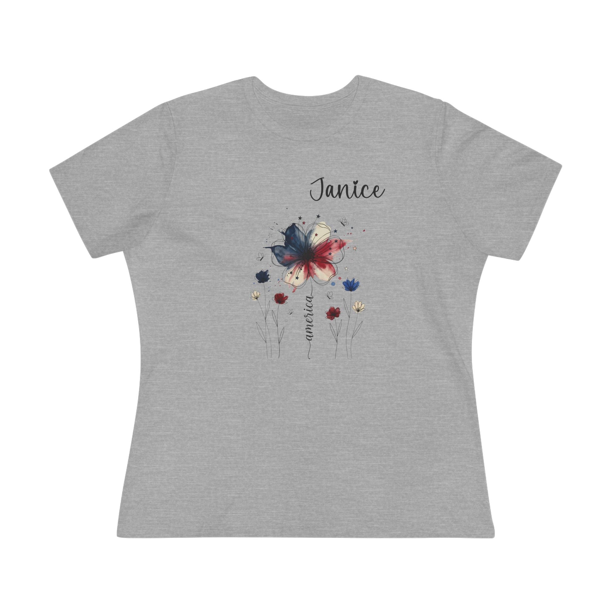 Close-up of the patriotic watercolor flower design in indigo, crimson and cream on a women's tee