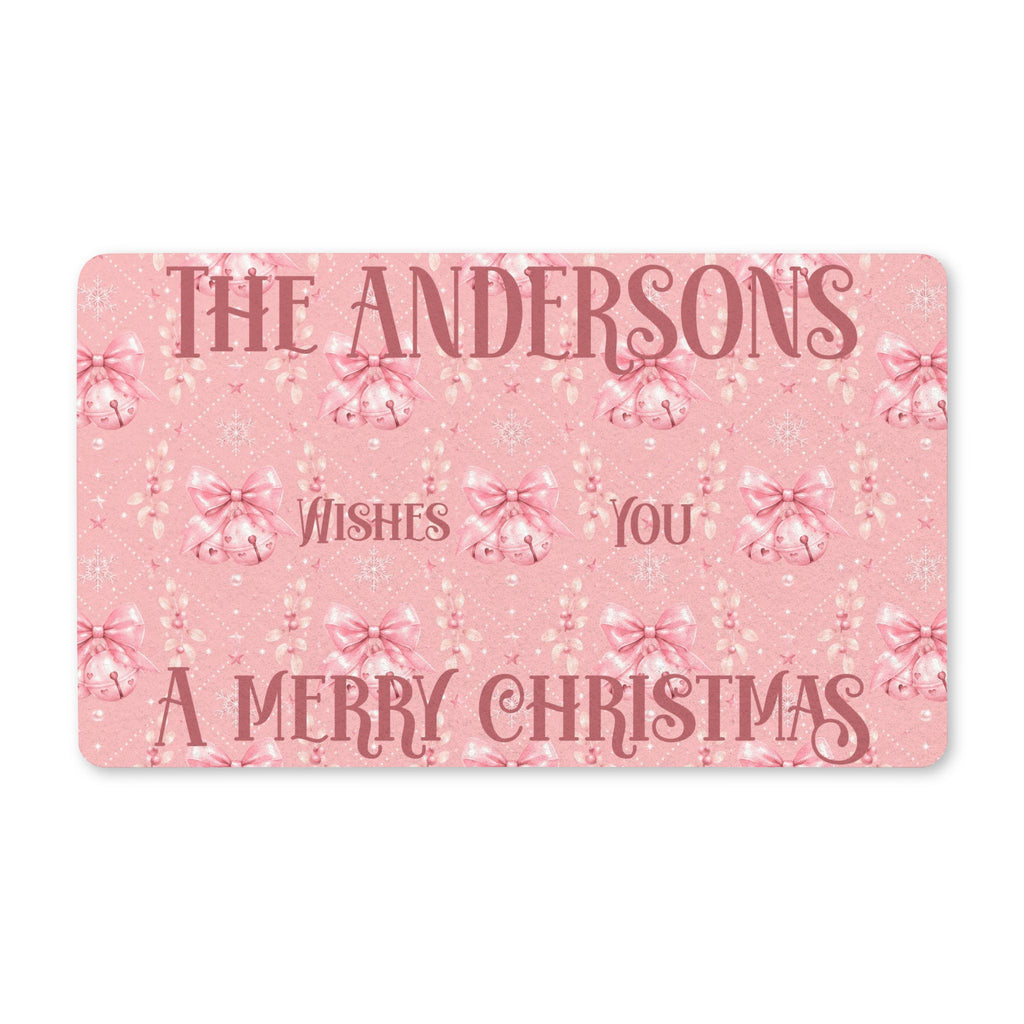 Personalized pink Merry Christmas doormat with a family name greeting, pink bells and bows
