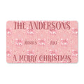 Personalized pink Merry Christmas doormat with a family name greeting, pink bells and bows