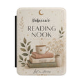 Personalized reading nook Kindle case with stacked books, a mug, a crescent moon, and a custom name reading Reading Nook