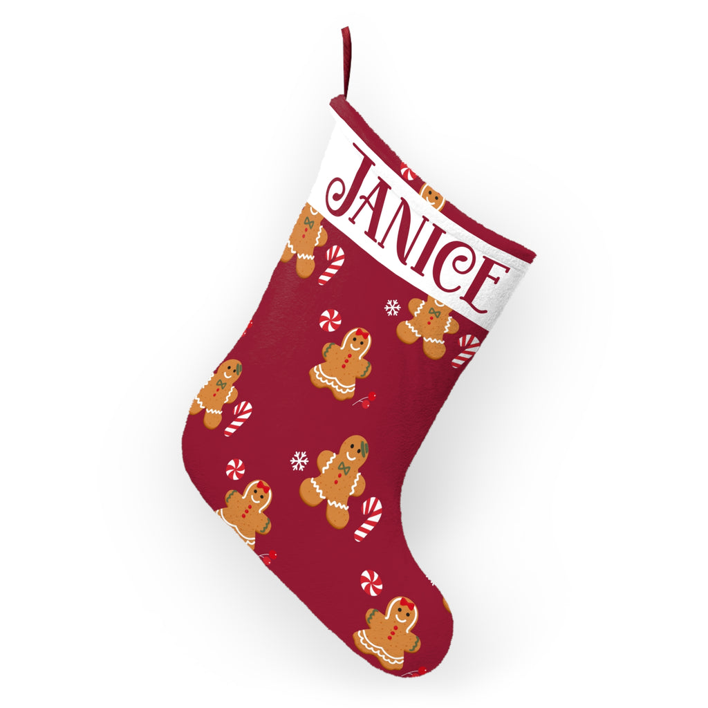 Red gingerbread Christmas stocking shown hanging as festive mantel decor