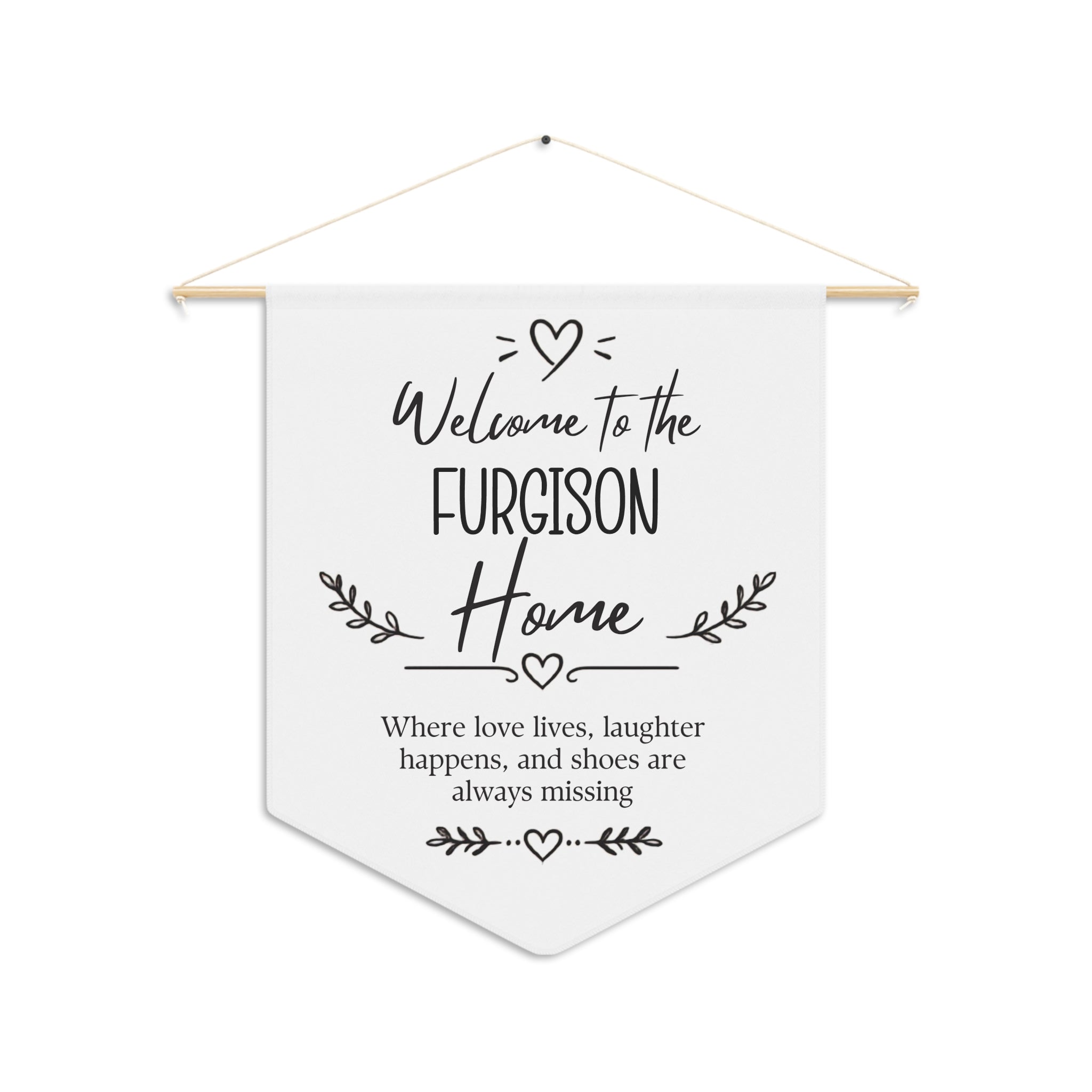 Personalized welcome home pennant with a family name and the words Where love lives, laughter happens, and shoes are always missing