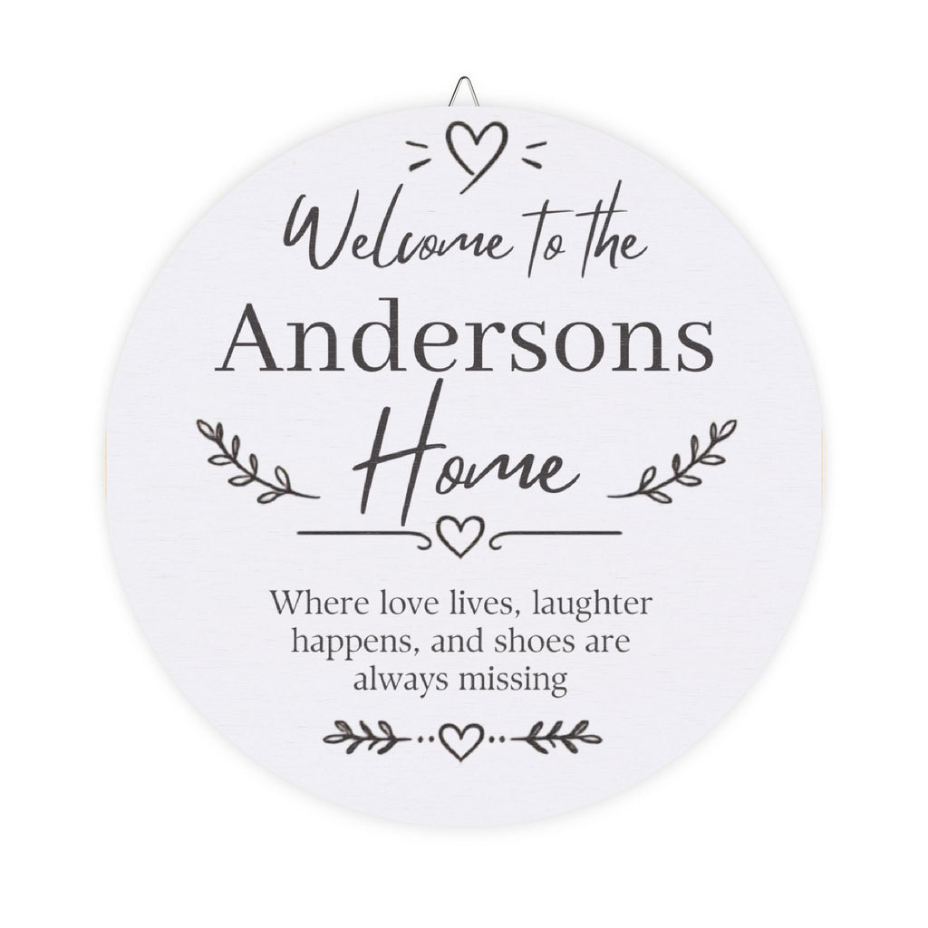 Personalized welcome home wood plaque with a family name and the words Where love lives, laughter happens, and shoes are always missing