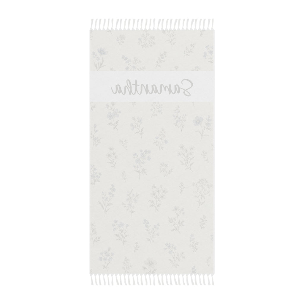 Personalized wildflower beach towel laid flat with boho tassels