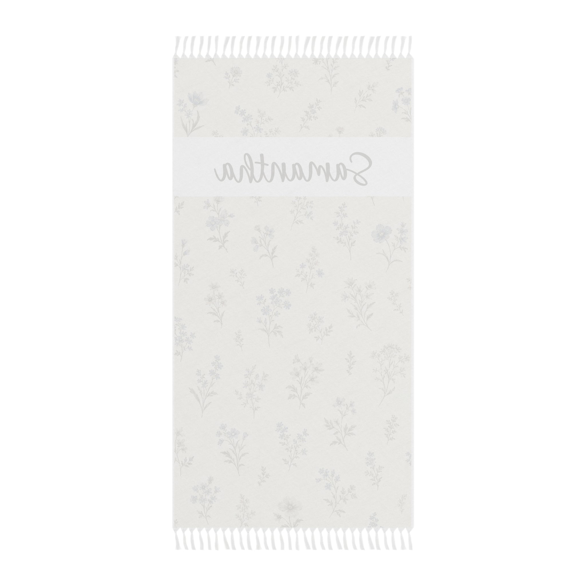 Personalized wildflower beach towel laid flat with boho tassels
