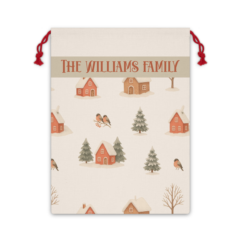 Personalized winter village Santa sack with a family name band, snowy cottages, pine trees and birds on a cream drawstring bag