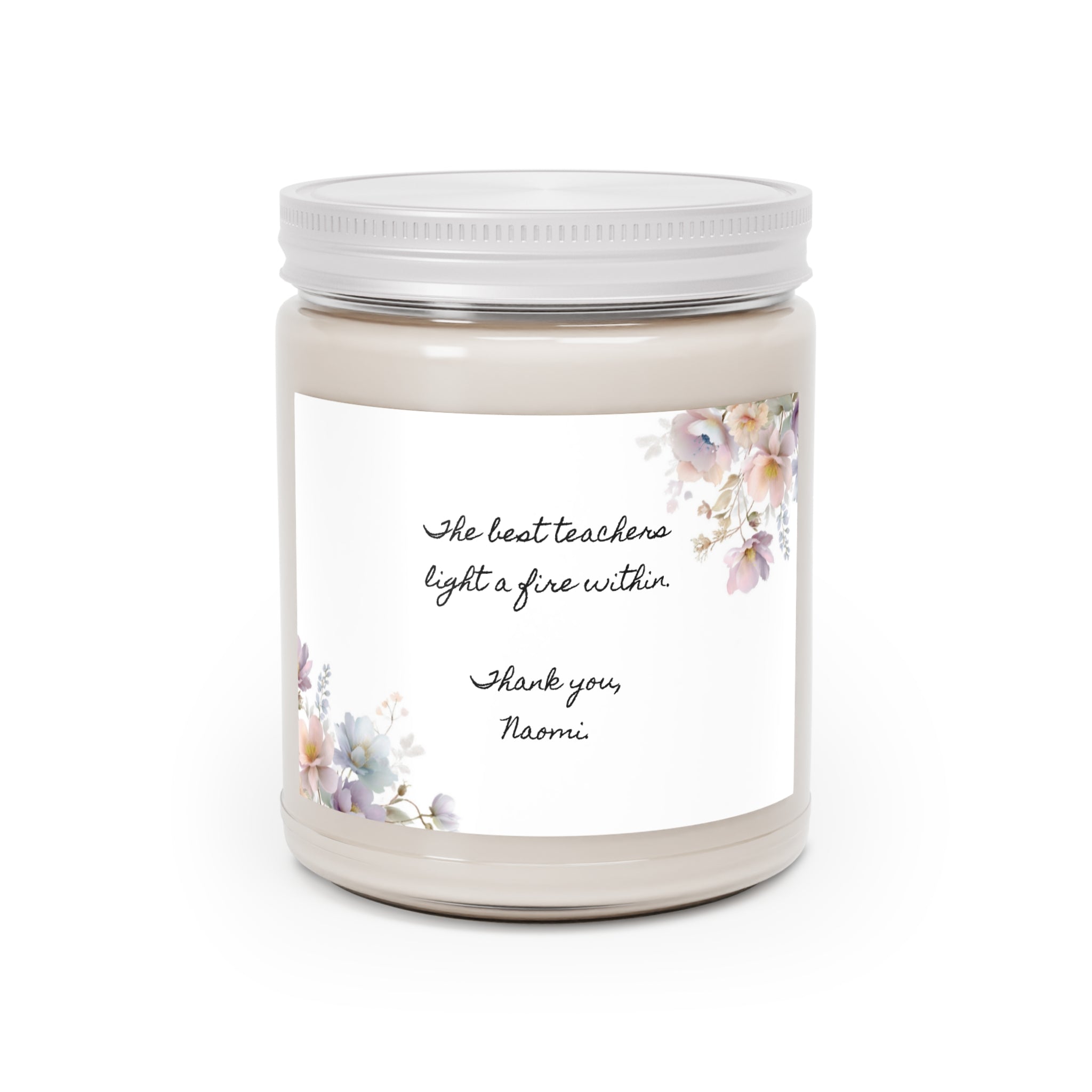 Personalized teacher appreciation soy candle in a white-lid glass jar with a watercolor floral label reading The best teachers light a fire within