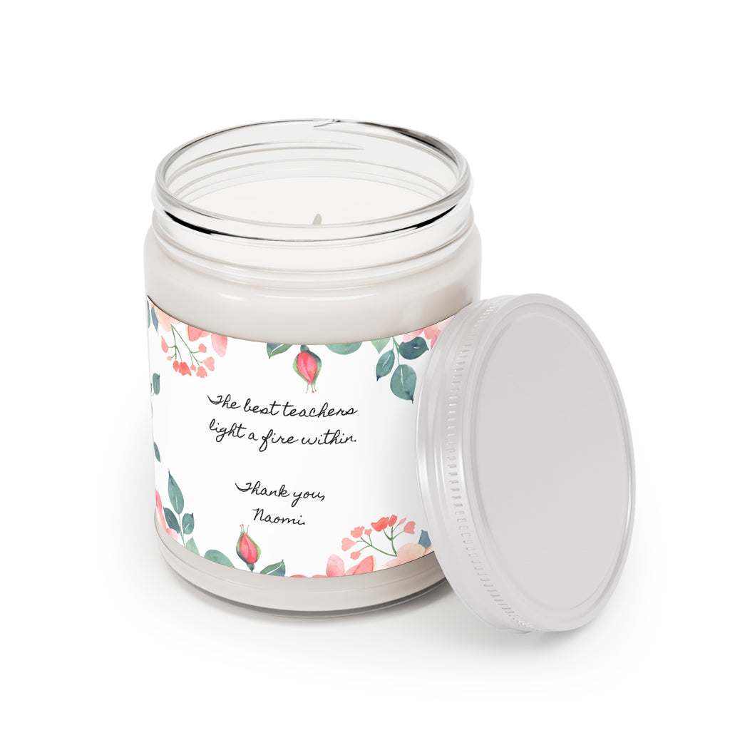 Teacher appreciation candle shown beside fresh flowers